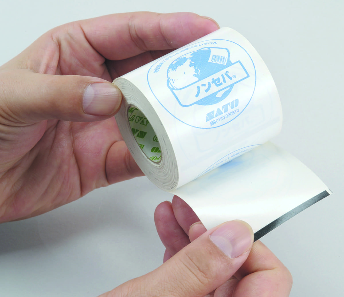 ST005479 - Linerless labels roll in hand