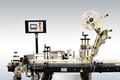 ETICHETTATRICI AUTOMATICHE PER INDUSTRIA CONSERVIERA